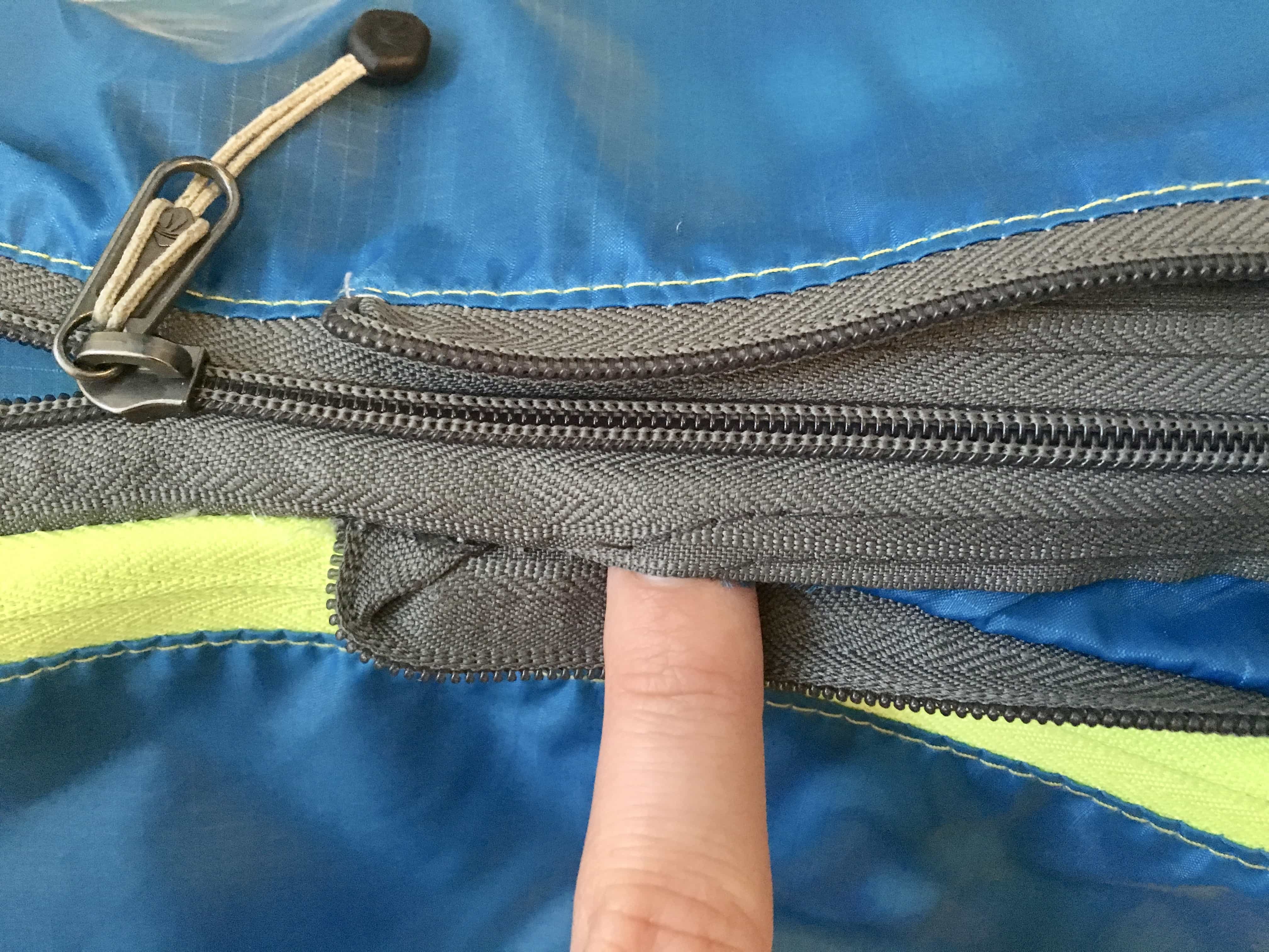 1" tear at the seam of zipper