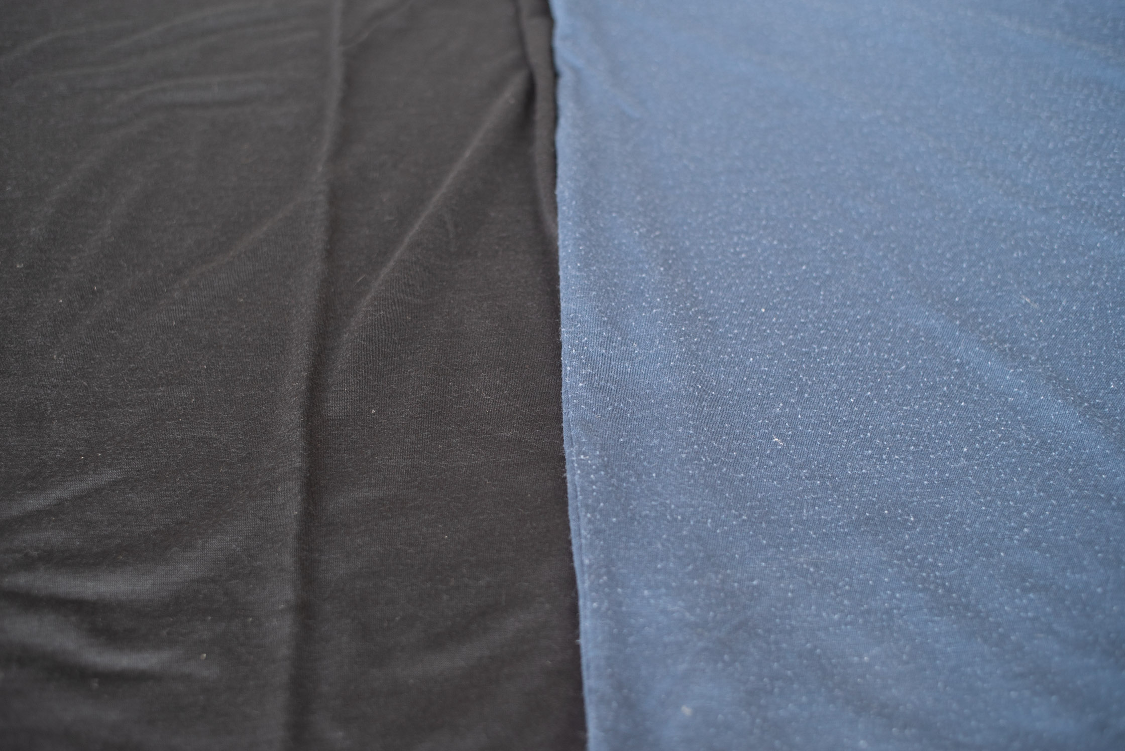 Left: New Runweight Merino T-shirt in Black VS. Right: Used Runweight Merino T-shirt in Sea Blue