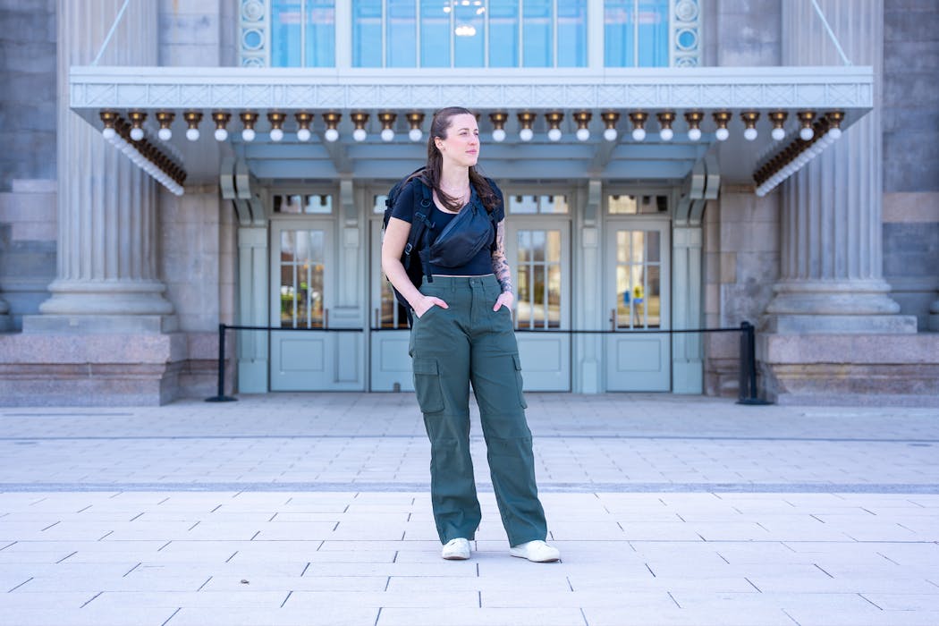 Wearing the prAna Stretch Zion Cargo Pant and Lo & Sons Bond Sling in Detroit | Featured Image for the Women's Digital Nomad Packing List