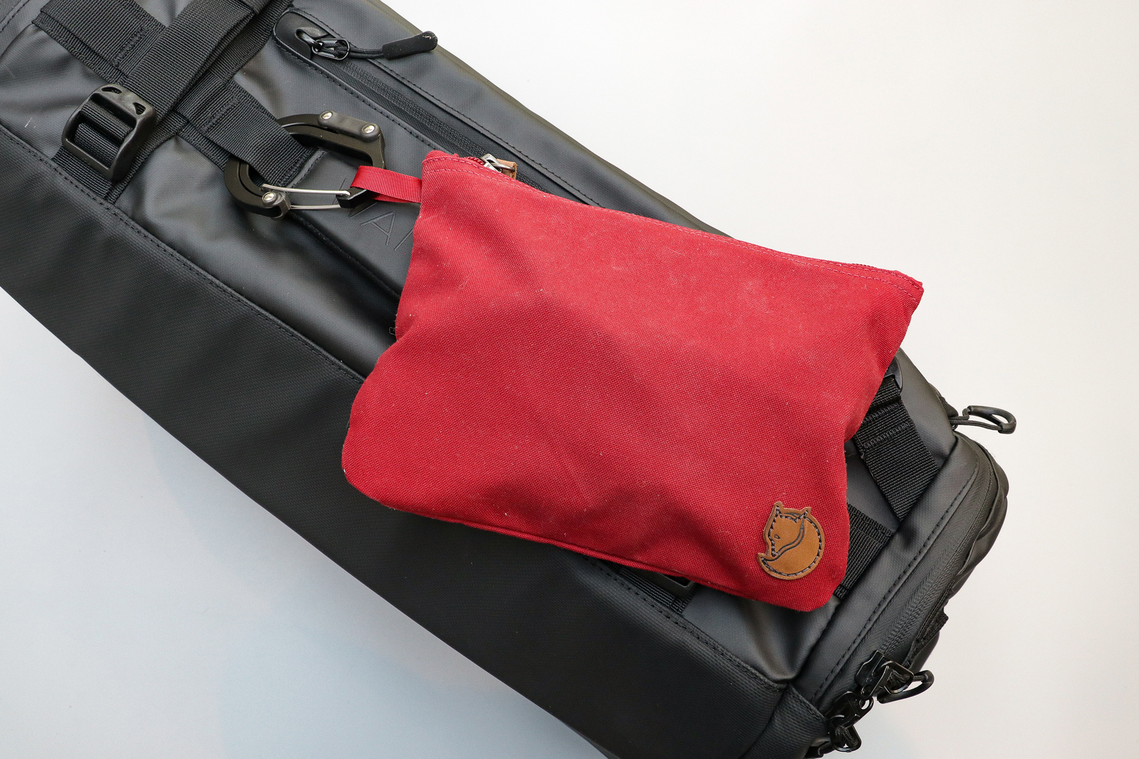 Fjallraven Gear Pocket Attached To The Wandrd Hexad Carryall Duffel With A Heroclip