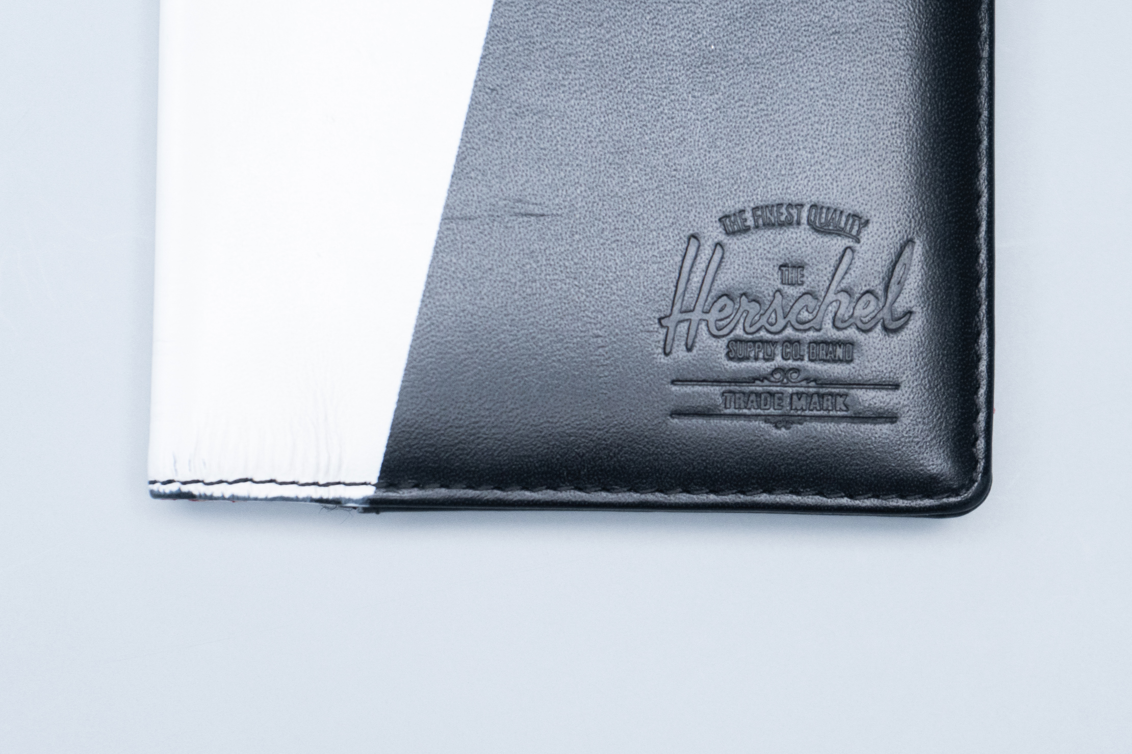 Herschel Supply Co. Raynor Passport Holder Logo and Material