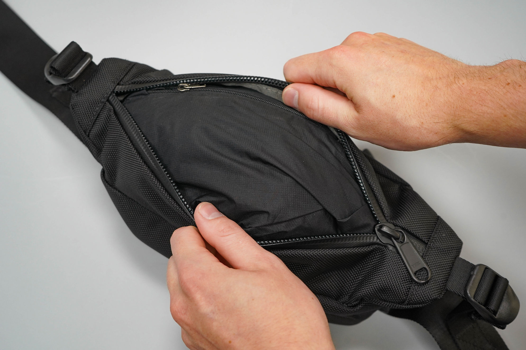 Aer City Sling Front Pocket With Rain Jacket Inside