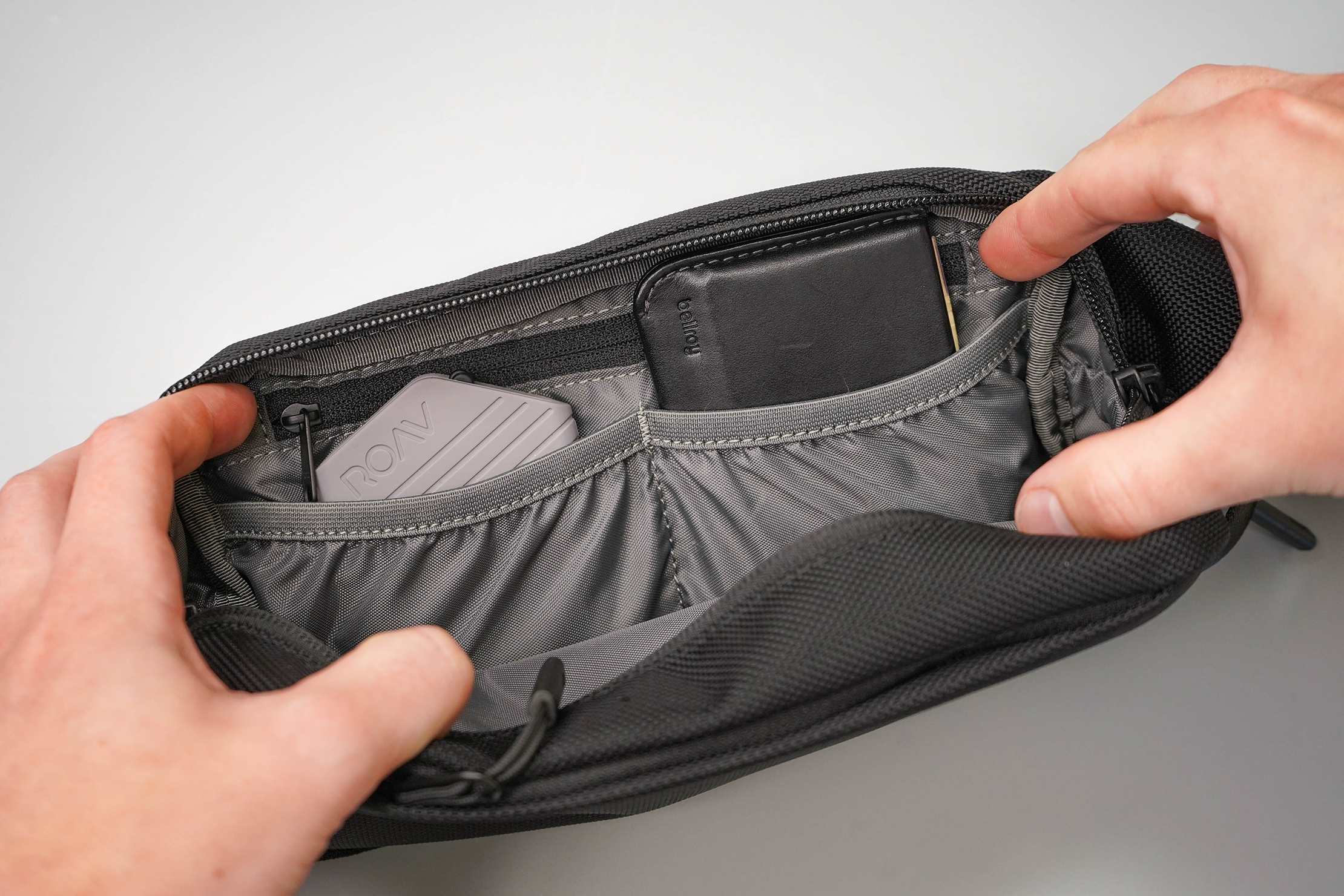 Aer City Sling Inside Divider Pockets In Use