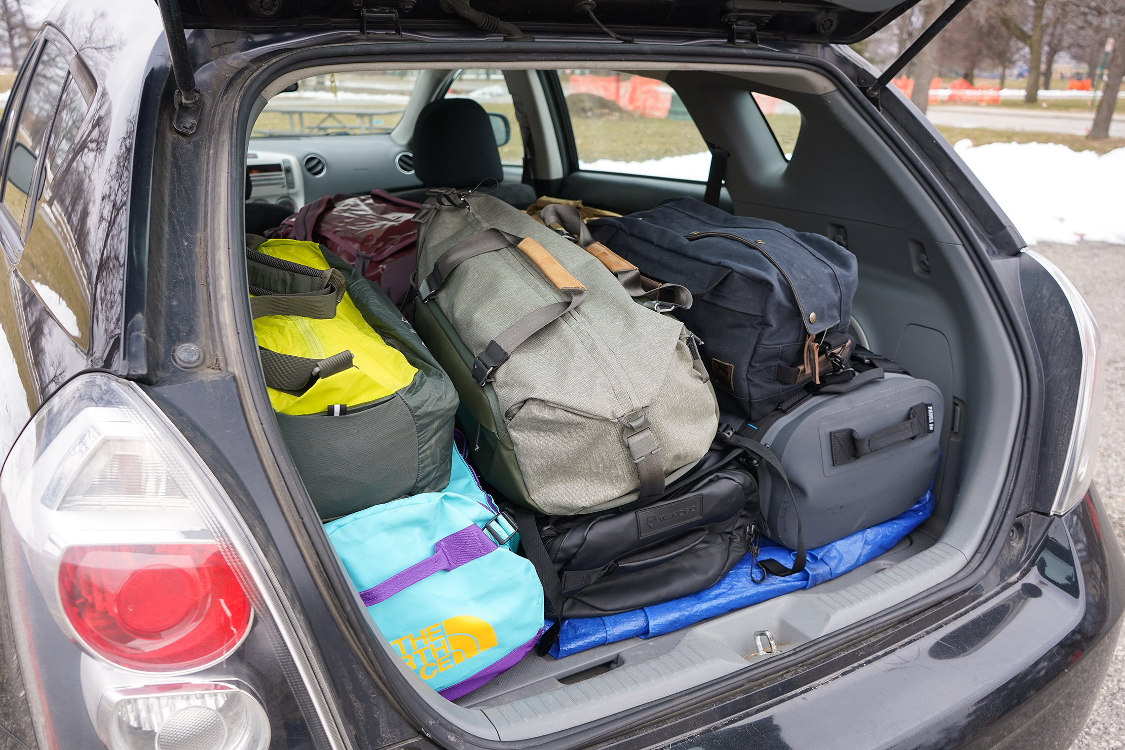 Lots Of Duffles In The Trunk Of A Car