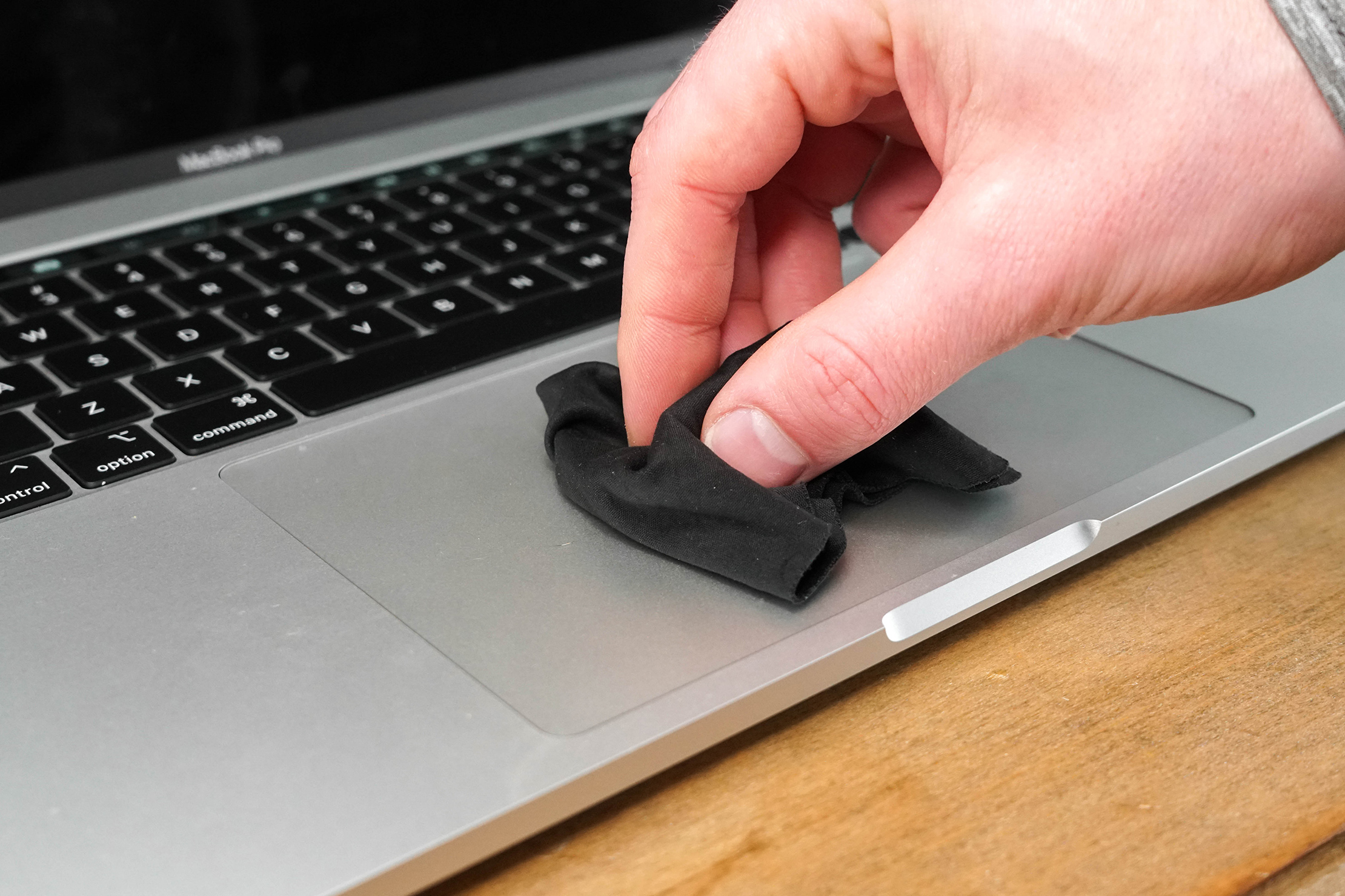 Wiping Trackpad with Cloth