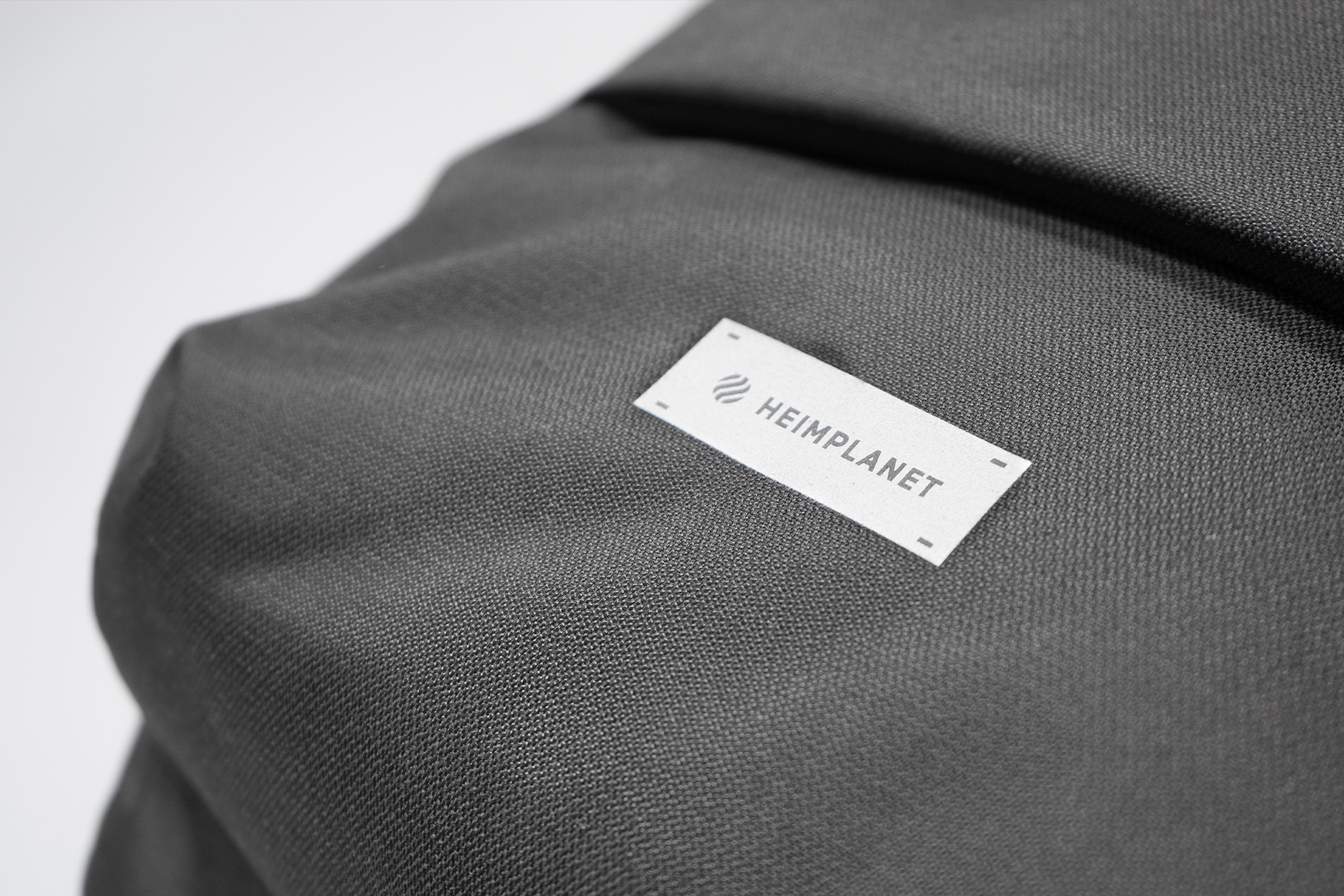 Heimplanet Commuter Pack Material and Logo