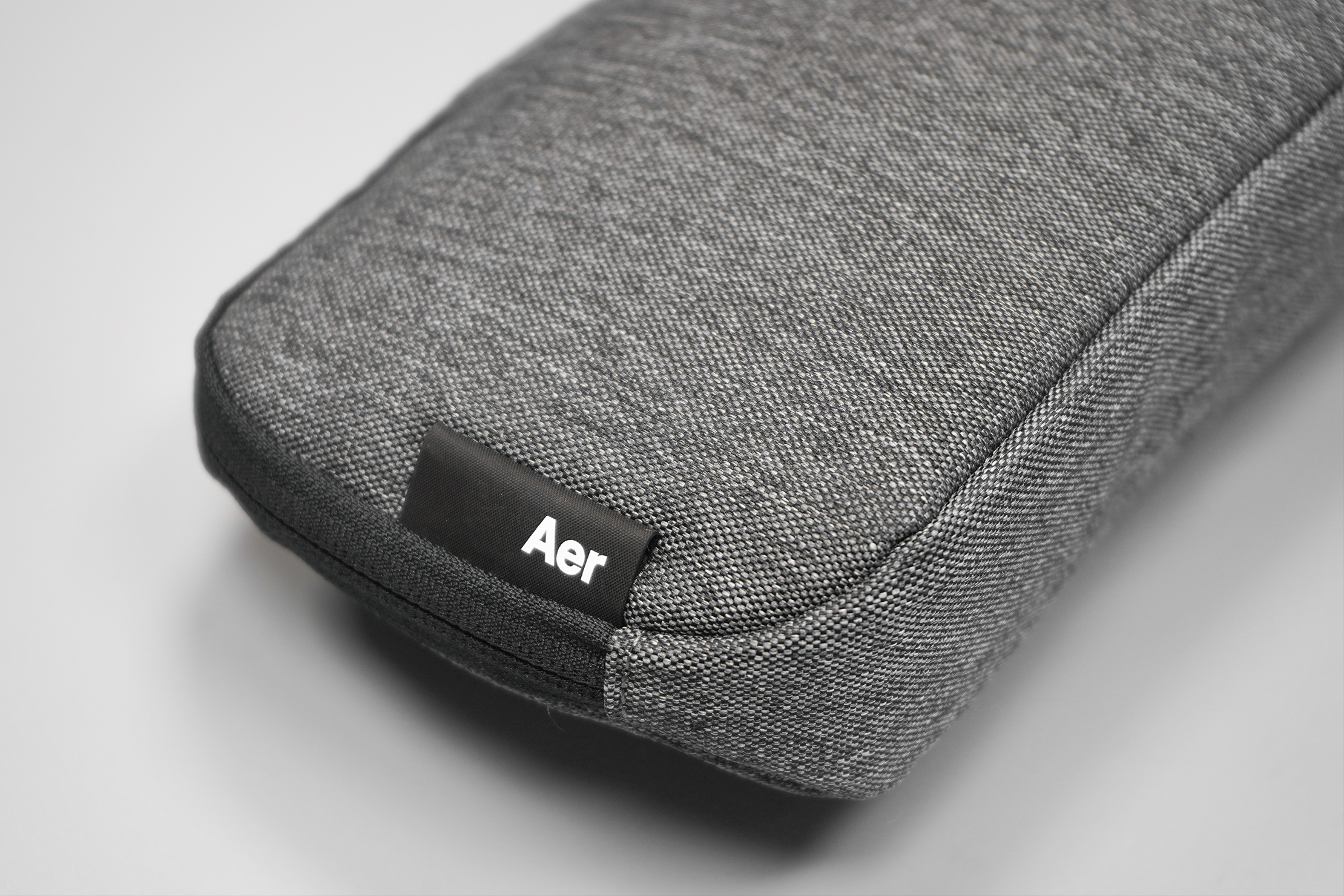 Aer Slim Pouch | This minimalist tag apes Aer's retail store signage