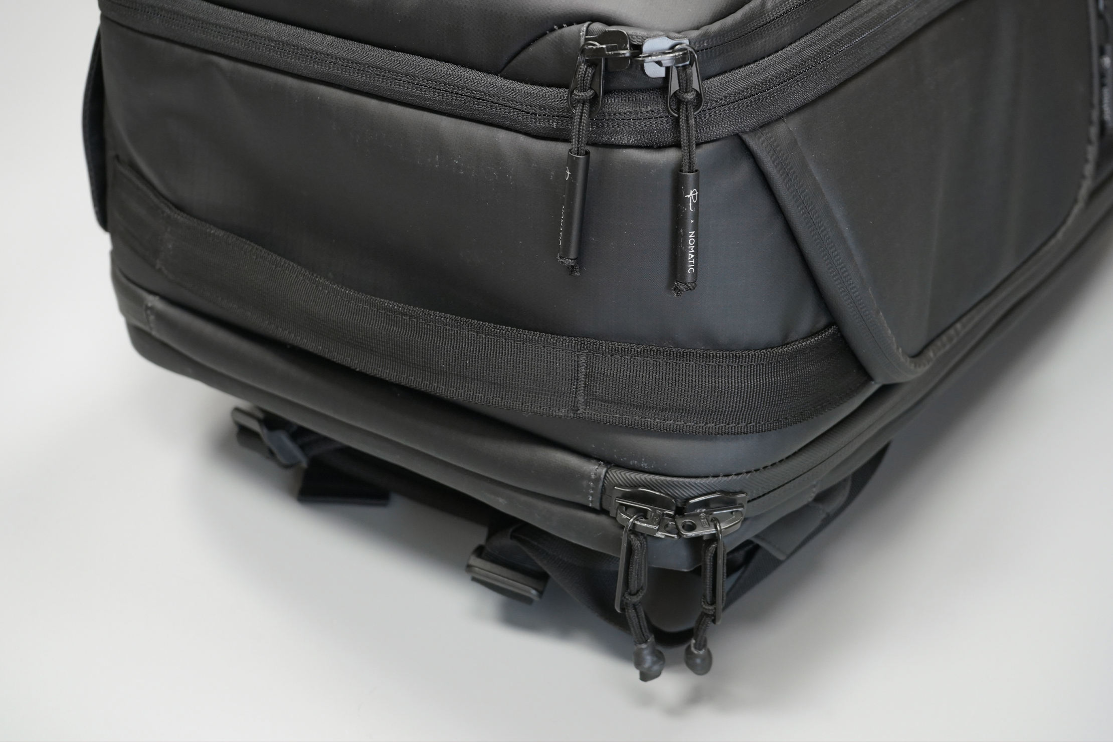 NOMATIC McKinnon Camera Pack 35L | A bottom handle to grab on to in case things go upside-down