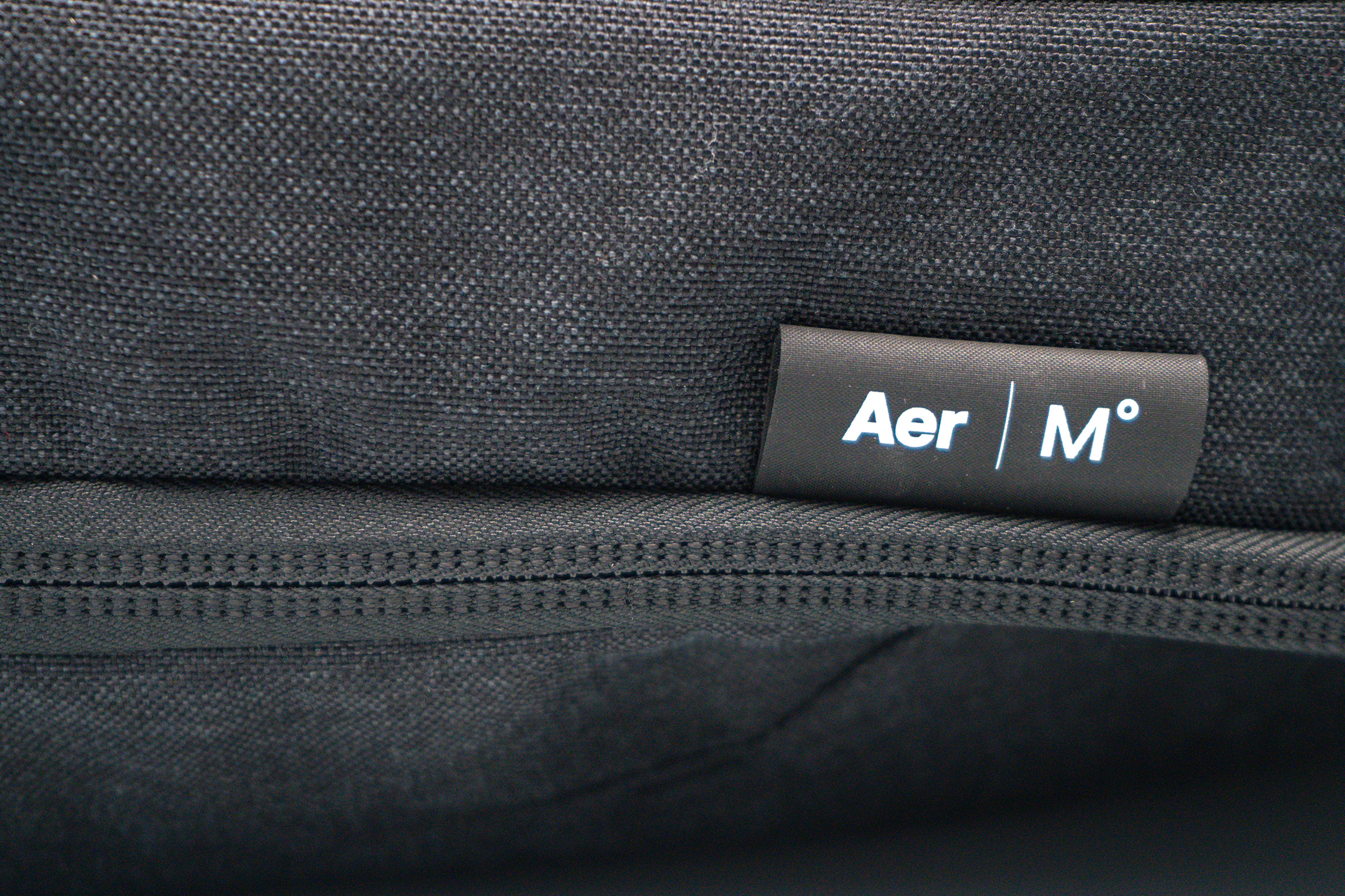 Aer x Ministry of Supply Lunar Pack Logo and Material