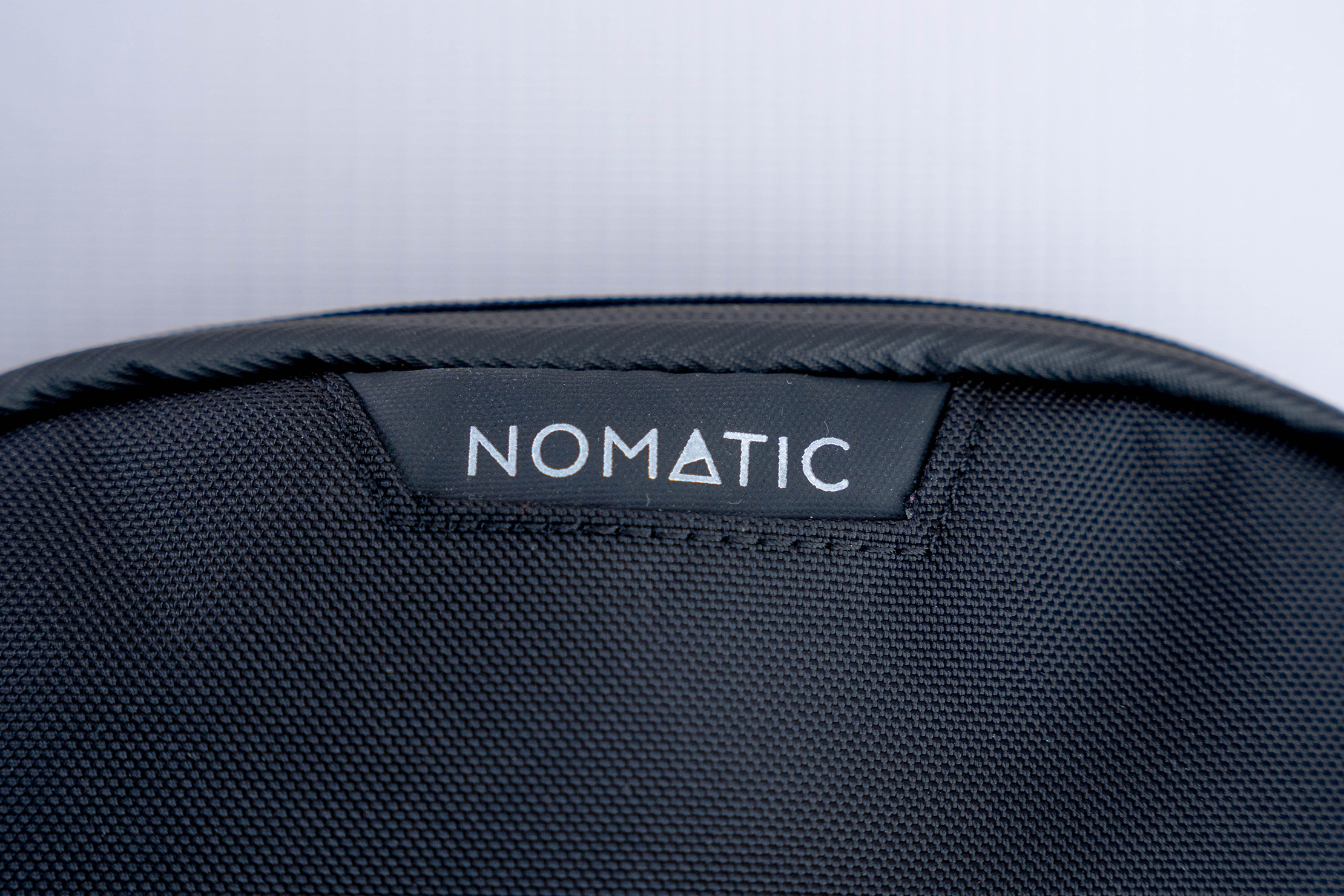NOMATIC Access Sling Brand