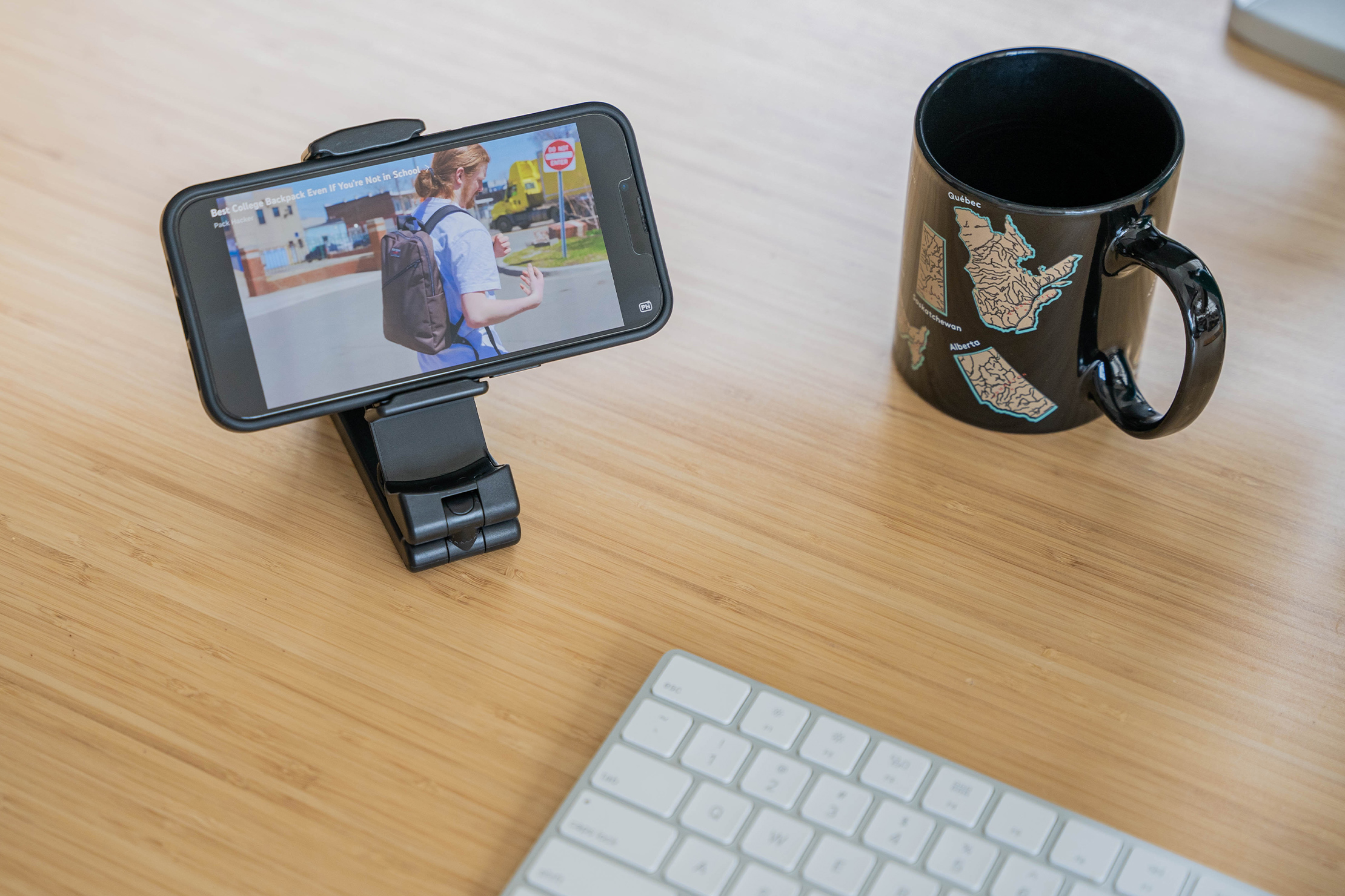 This pocket-sized phone holder mounts to airplane tray tables