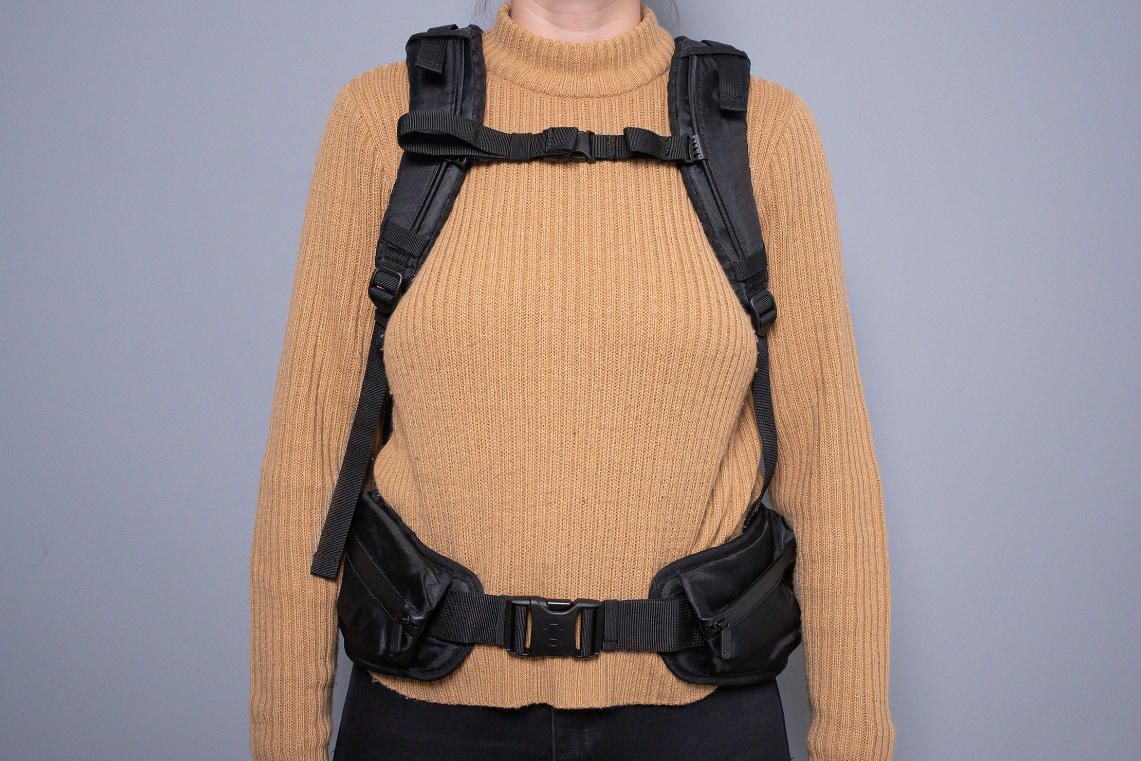 How does a rucksack with a hip belt and chest strap compare to a