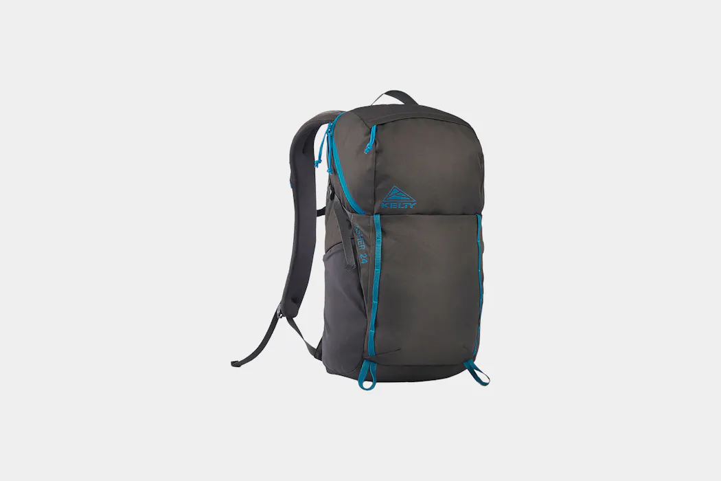 head hidding the back of kelty backpack Coyote 60-105 Liter Internal Frame medium for 30 50 liter packs Brand: Kelty | Pack Hacker