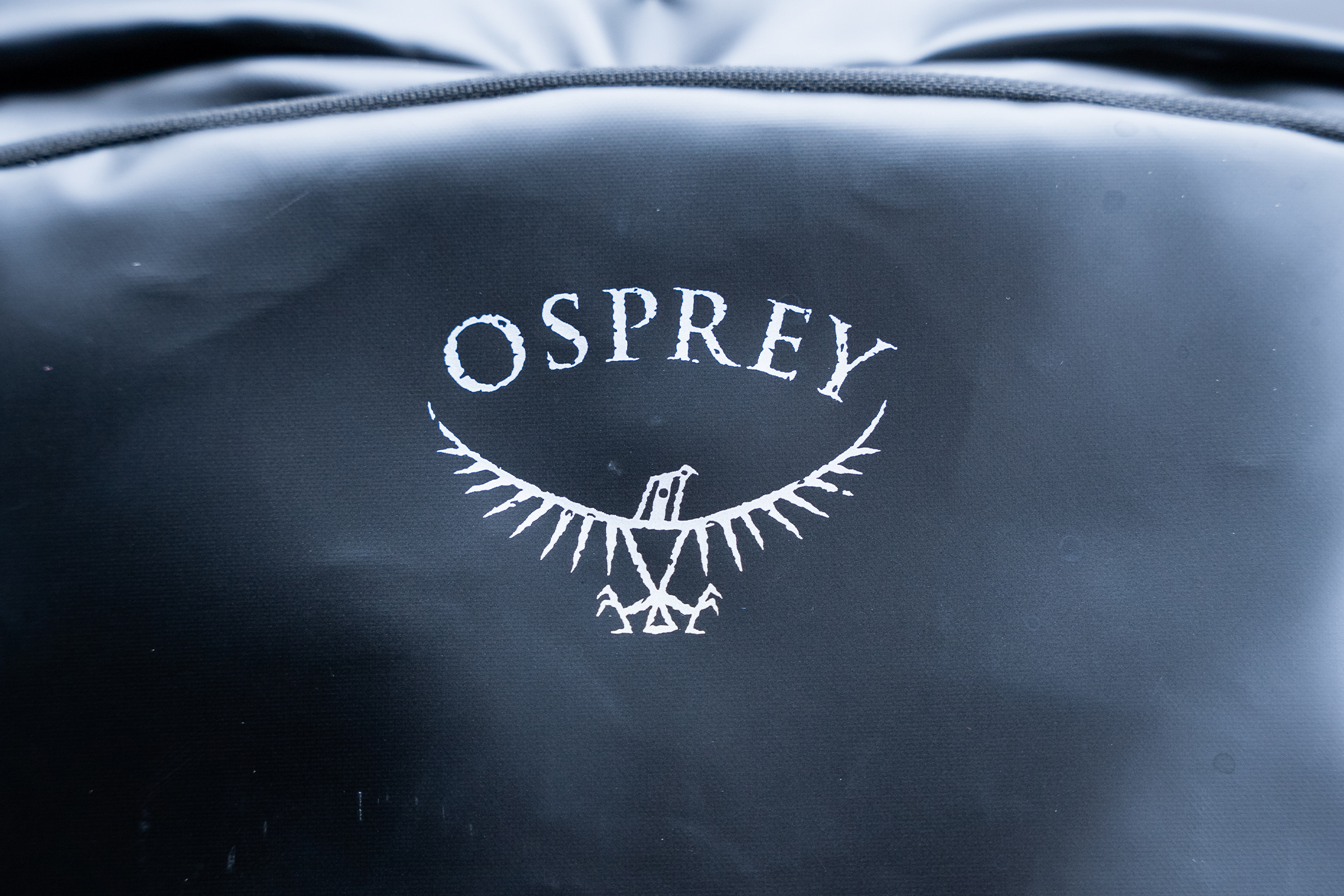 Osprey Transporter Wheeled Carry-On 38 Logo