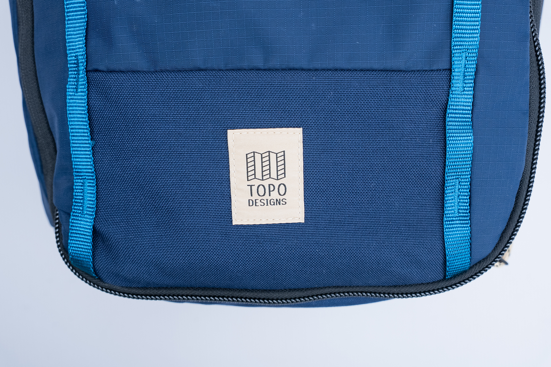 Topo Designs Global Travel Backpack Logo