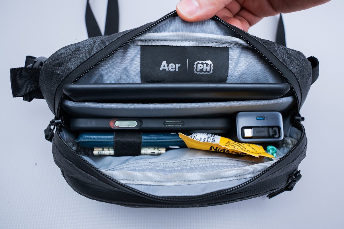 The Pack Hacker x Aer Ultra Sling main compartment packed with gear