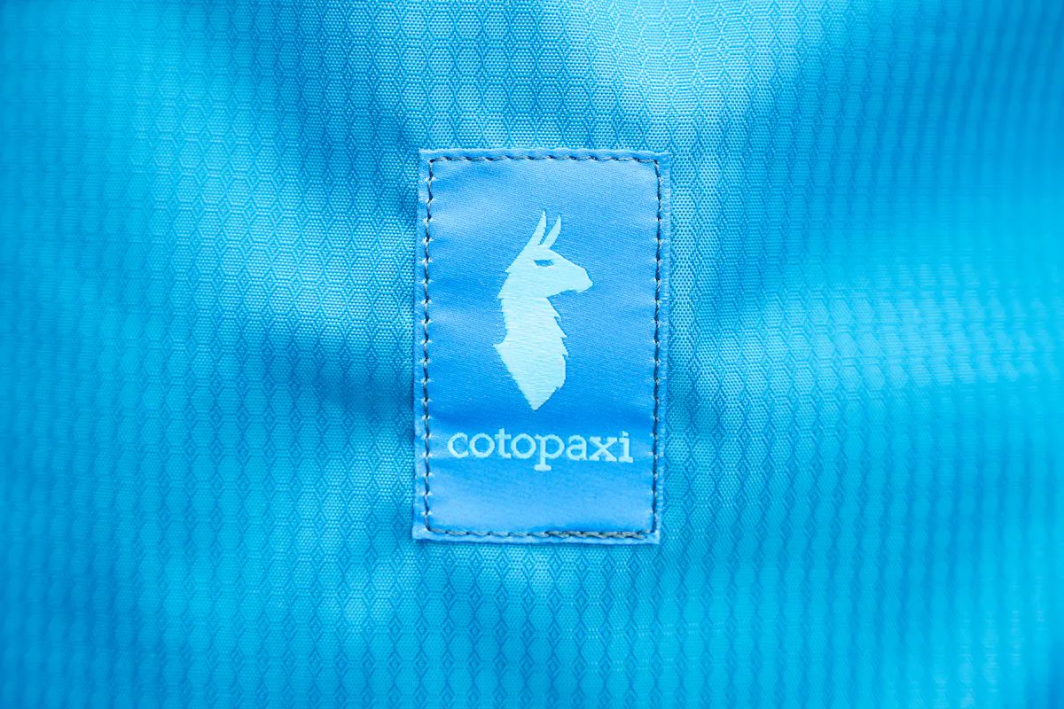 Cotopaxi Allpa 26L Daypack Logo